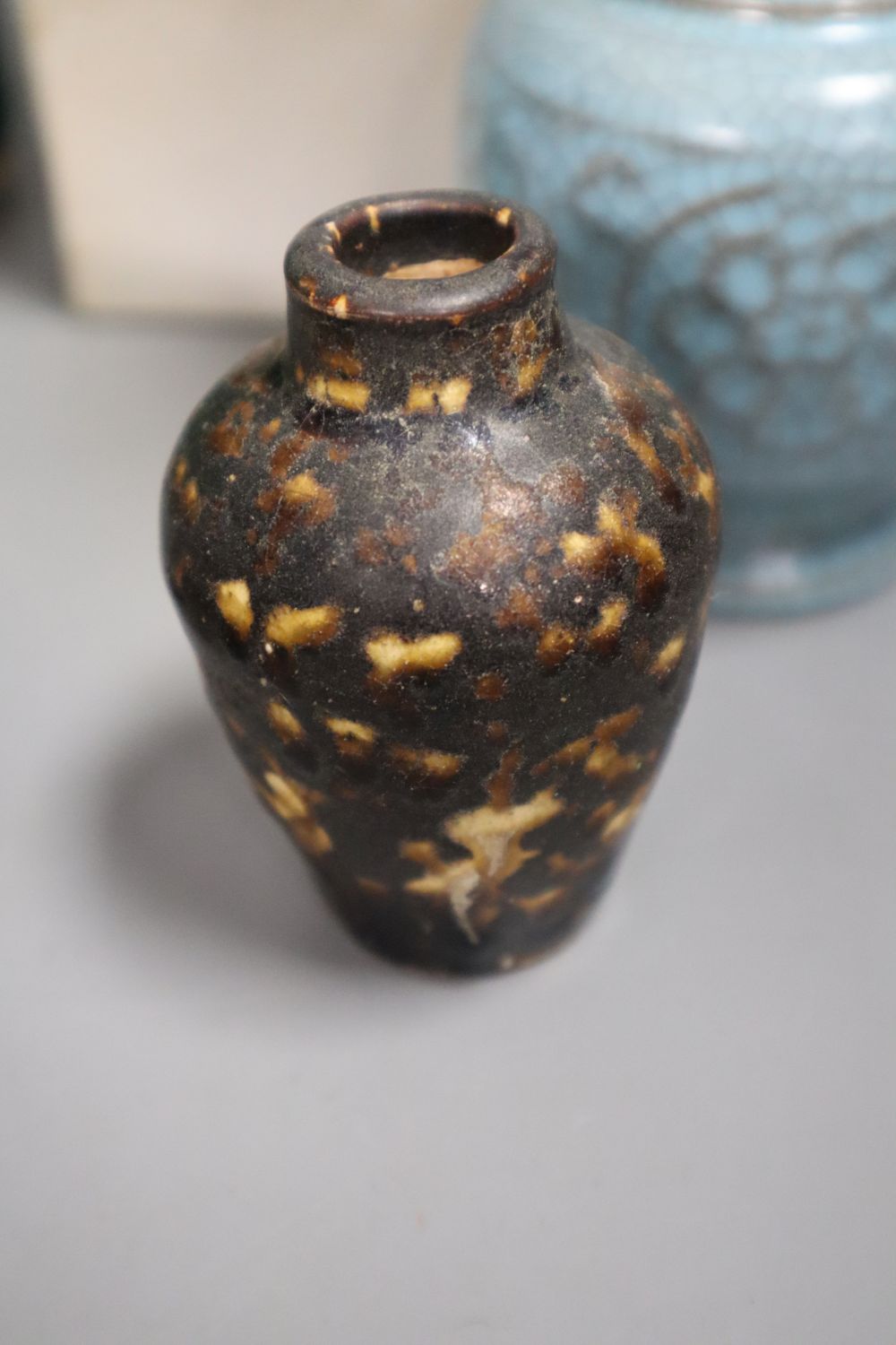A Chinese green glazed teapot, 20.5cm high, a Cizhou type vase, a turquoise glazed vase and a Japanese tea bowl